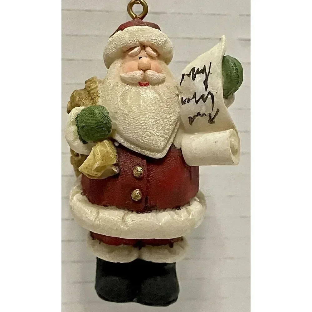 Santa Carrying Gold Toy Bag and Naughty Or Nice List Ornament 3”